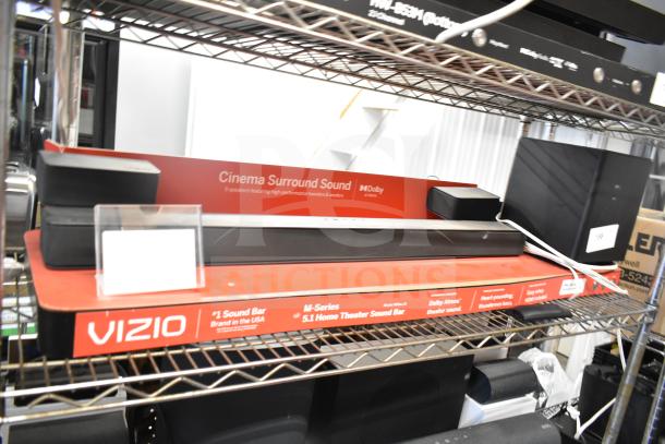 Vizio store display with M-Series 5.1 Cinema Surround Sound Bar, featuring Dolby Atmos, in good condition.