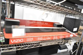 Vizio store display with M-Series 5.1 Cinema Surround Sound Bar, featuring Dolby Atmos, in good condition.