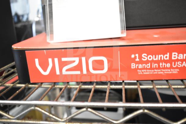 Vizio Store Display with Cinema Surround Sound Bar, #1 Sound Bar Brand in the USA, slight wear visible.