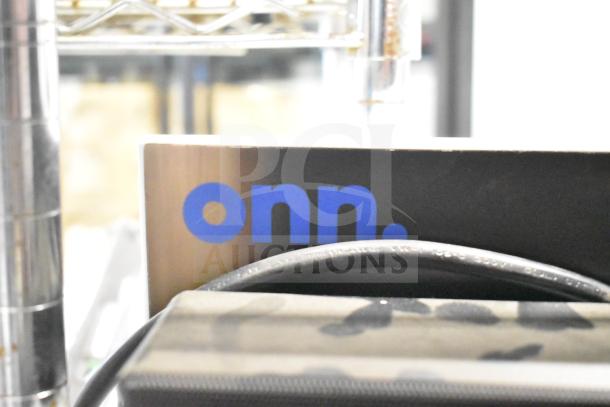Onn store display featuring speakers and sound bar, brand logo visible, good condition.