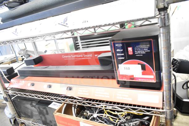 Vizio store display with sound bar, featuring cinema surround sound. Display shows Dolby, dtsX, Bluetooth, HDMI logos.