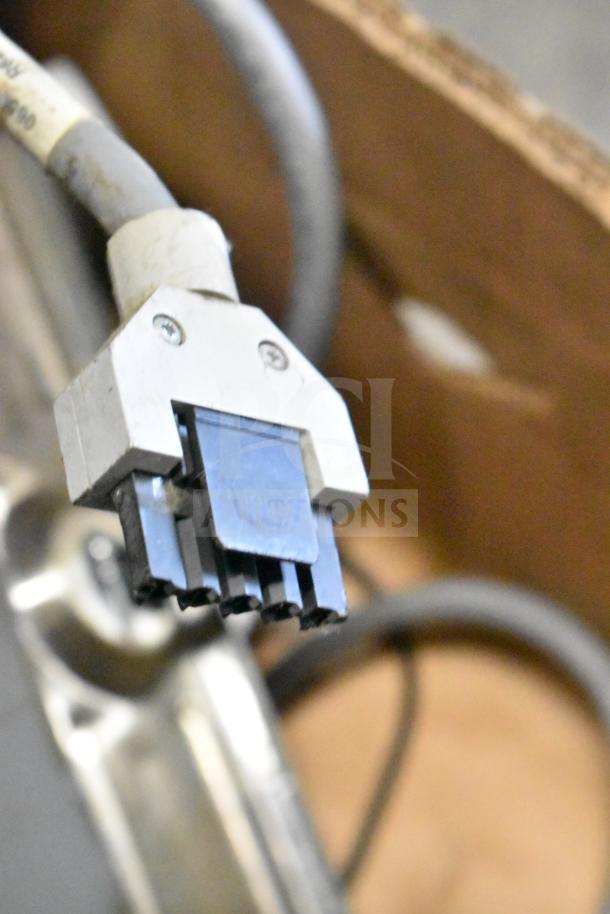 Lot of various items including cables and Sensormatic ZBSTPSP-L, showing close-up of connector. Used condition.