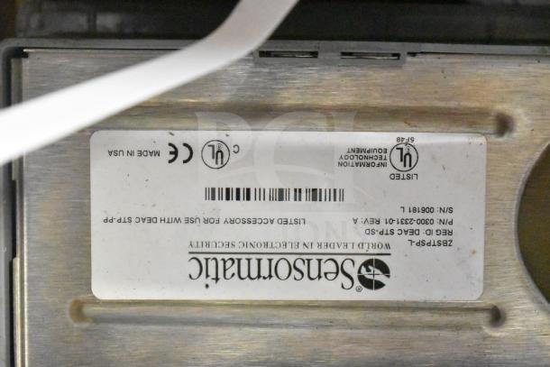 Sensormatic ZBSTPSP-L device with label showing certifications and model details. Included in a lot with various cables.