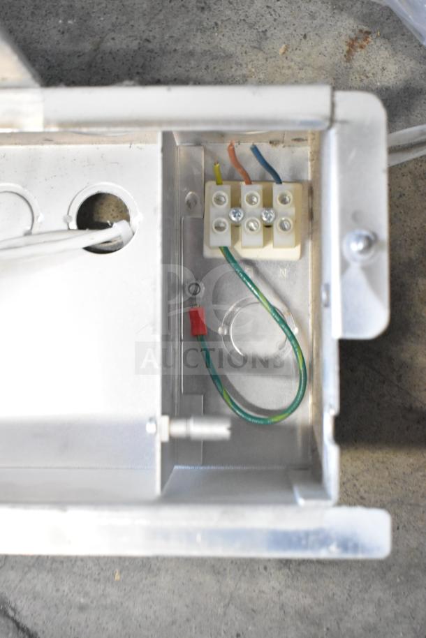 Electrical wiring inside metal casing of one electronic unit; part of auction lot with Rave+ display and two electronics.