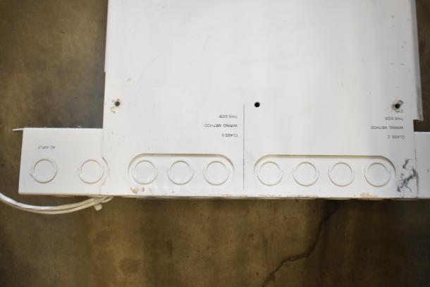 Three assorted items including a Rave+ store display and two electronic units. Visible labels: "AC Input," "Class 2," "Wiring Method."