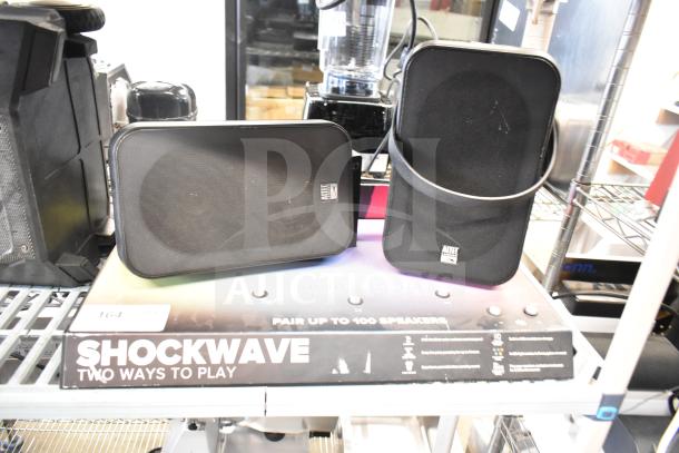 Shockwave store display with two Altec Lansing speakers, black, used condition, featuring "Two Ways to Play" tagline.
