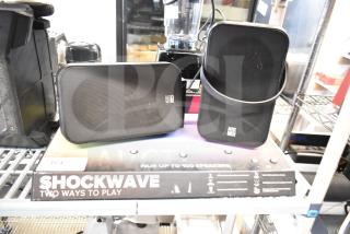 Shockwave store display with two Altec Lansing speakers, black, used condition, featuring "Two Ways to Play" tagline.