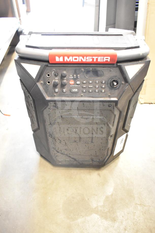 Monster Speaker with control panel, USB port, and rugged design. Features branded logo, worn condition. Perfect for powerful sound.