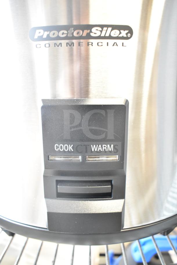 Proctor Silex 37560R 60-cup electric rice cooker, scratch and dent condition, cook/warm settings visible, 120 volts.