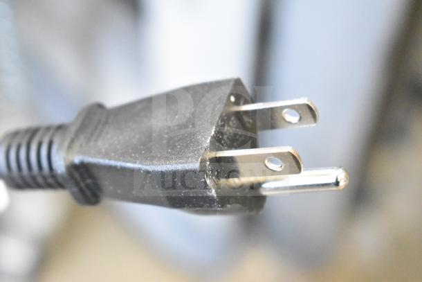 Close-up of a standard electrical plug for the Proctor Silex 37560R electric rice cooker, 120 volts.