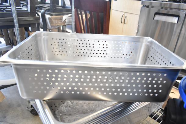 Stainless steel perforated drop-in bin, new condition, visible scratch marks, commercial kitchen equipment.
