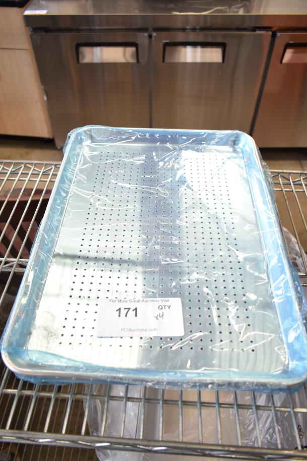 Brand new perforated baking pan with scratch and dent. Pack of 4. Wrapped in plastic. Auction tag with quantity visible.