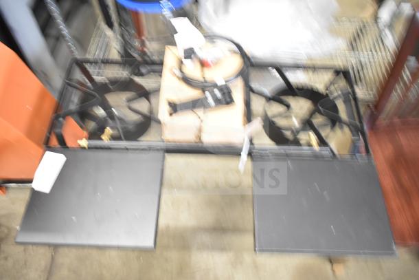 Brand new 2 burner propane gas range with minor cosmetic dents. Comes with attached gas hose and control knobs.