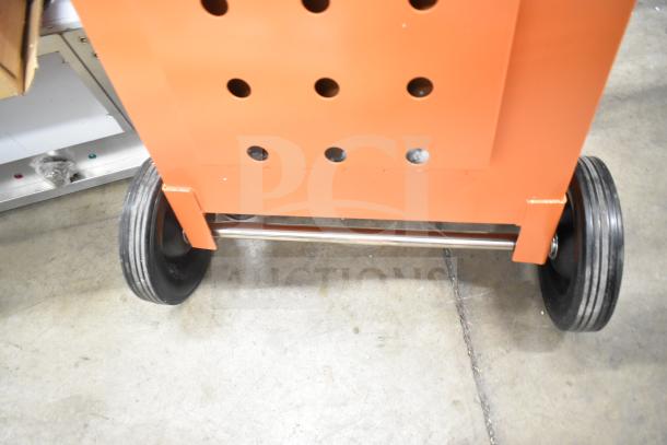 BRAND NEW Fryclone 259OS100 Fryer Oil Shuttle, 70-100 lb capacity, orange, slight scratches and dents, sturdy wheels.