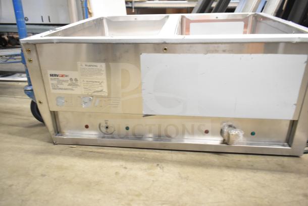 BRAND NEW SCRATCH AND DENT! 2025 ServIt 423EST2WSPB two pan steam table, sealed well, partially enclosed base, 120V, 1 phase.