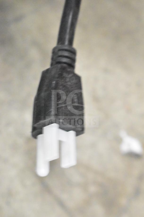 Black and white power plug for the 2025 ServIt 423EST2WSPB electric steam table, 120V, 1 Phase.