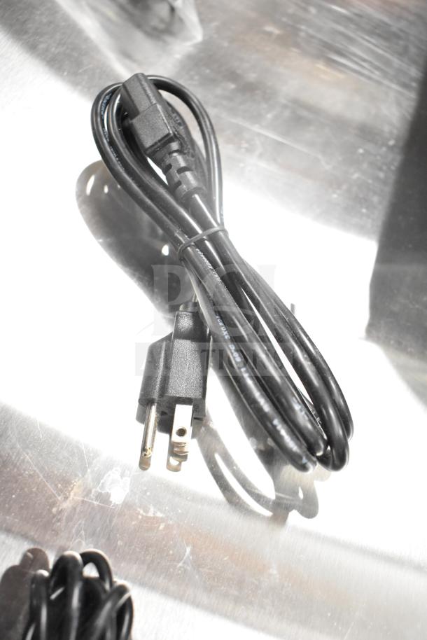 A black power cable for the Torrey L-PC-40L digital price computing scale, brand new condition.
