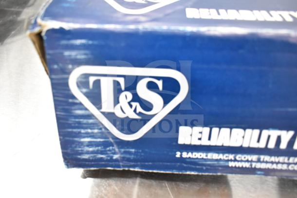 Box with T&S logo for T&S B-1141-04 workboard faucet, indicating reliability, and showing slight wear on edges.