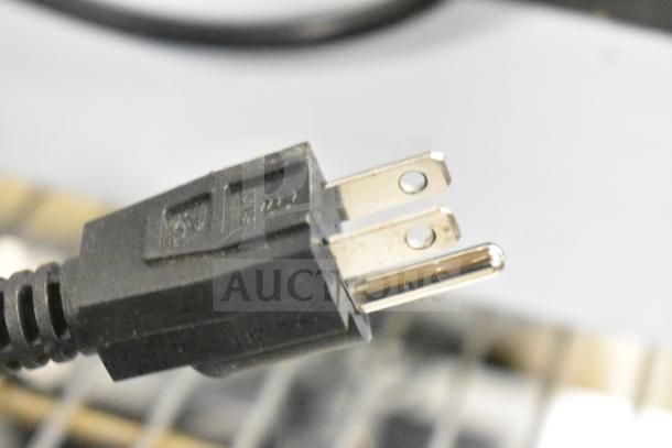 Carnival King 382SBW4 sauce bottle warmer plug, 120V. Close-up of a two-prong power plug, brand new condition.