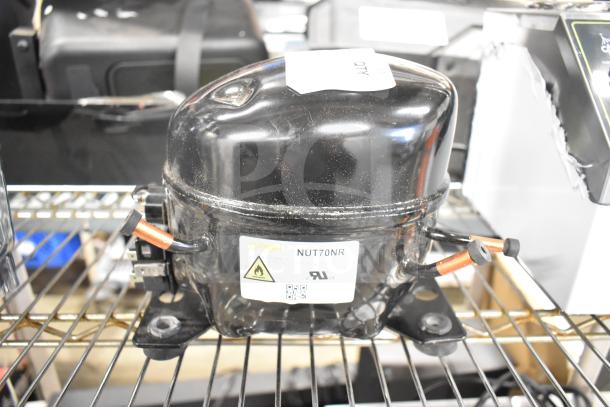 Cubigel NUT70NR Avantco 17817638 compressor, brand new with minor scratches, visible label indicating model and safety warnings.