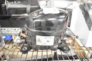 Cubigel NUT70NR Avantco 17817638 compressor, brand new with minor scratches, visible label indicating model and safety warnings.