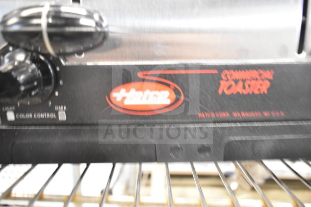 Brand new Hatco TPT-120 4-slice commercial toaster, 1 1/4" slots, 120 volts, 1 phase, minor scratches, color control knob visible.