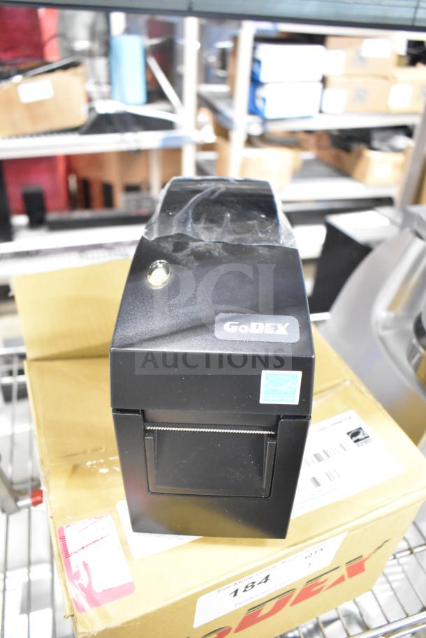 Brand new GoDex DT2x thermal label printer, black, ENERGY STAR certified, on original packaging.