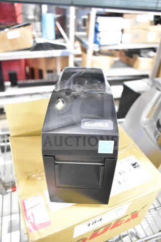 Brand new GoDex DT2x thermal label printer, black, ENERGY STAR certified, on original packaging.