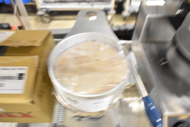 Brand new Edlund EBP-500 countertop hamburger patty press, 5" diameter, scratch and dent condition, visible label.