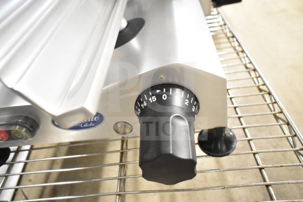 Brand new Globe Chefmate C12 meat slicer with blade sharpener, scratch and dent. 115V, 1 phase, featuring precision dial.