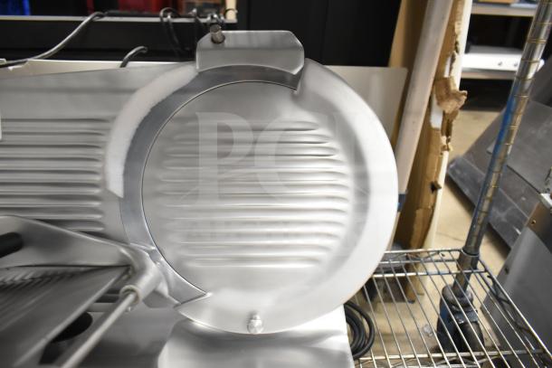 Brand new Globe Chefmate C12 meat slicer, 115V, scratch and dent, with blade sharpener. Commercial countertop model.