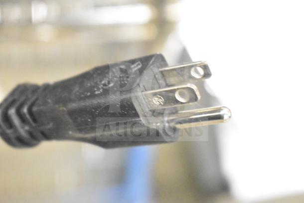 Alt text: Close-up of a plug for the Globe Chefmate C12 Commercial Meat Slicer, 115 Volts, 1 Phase.