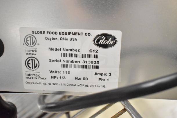 Globe Chefmate C12 meat slicer tag shows model, serial number, 115 volts, 1/3 HP, and ETL certification; Made in Italy.