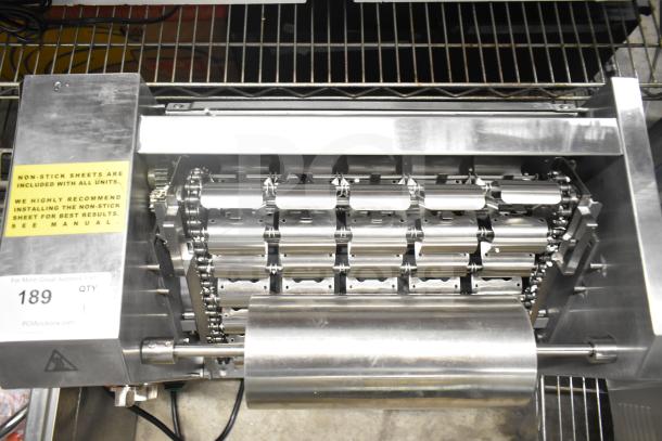 Brand new Avantco 184T18A conveyor bun toaster, 120V, 1-phase, with non-stick sheets. Minor scratches and dents visible.
