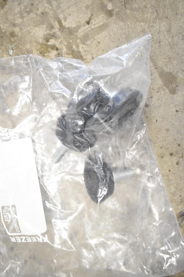 Plastic bag containing screws and black knobs, labeled "FREEZER: DATE; CONTENTS:". Items are in new condition.