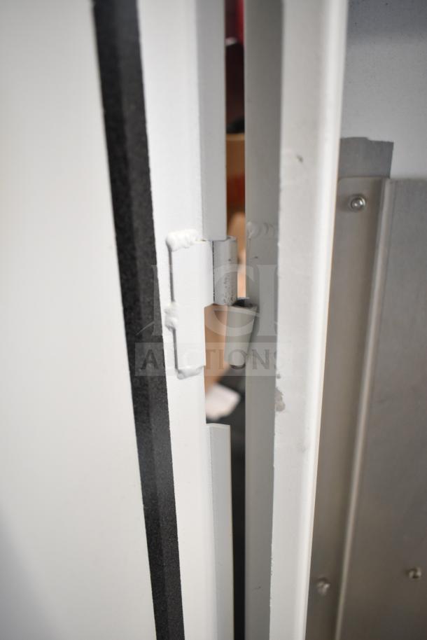 Sensormatic ZPUODPP-ENC-2 outdoor cabinet, white, close-up of hinge detail. Sturdy condition, suitable for secure storage.