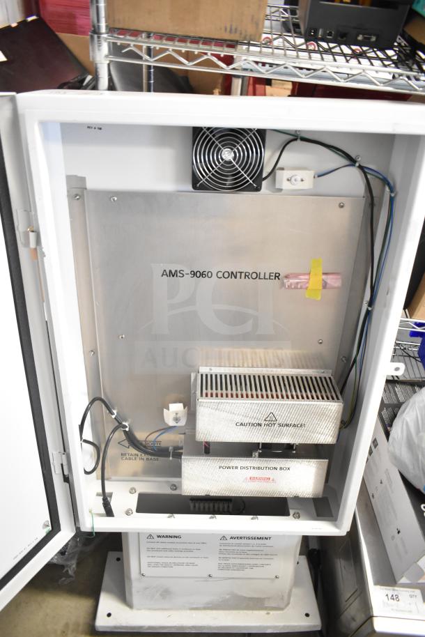 Sensormatic ZPUODPP-ENC-2 Outdoor Cabinet, contains AMS-9060 Controller. Visible warning labels, power distribution box.