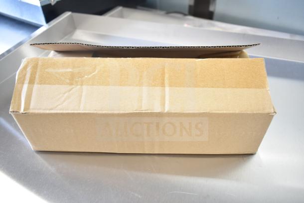 Cardboard box containing Cooking Performance Group Commercial Griddle, new with minor dents, thermostatic controls.