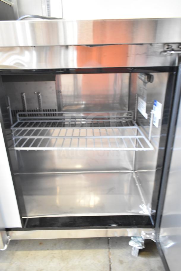 Alt text: Avantco 178AU72R 3-door undercounter cooler, brand new with scratches and dents, 115V, stainless steel interior.