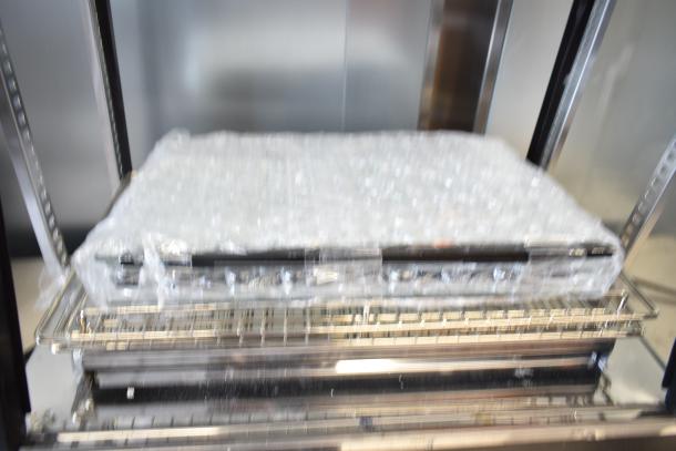 Brand new Avantco 177HDC26, 26" countertop heated display case, three shelves, 120V, missing glass panels, scratch and dent.