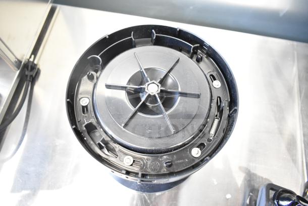 Brand new Curtis TXSG0101S600 ThermoPro 1-gallon insulated server with minor scratches and dents, shown on stand.