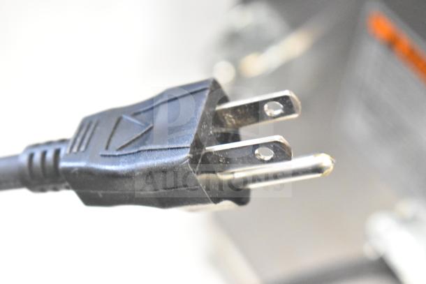 Black power cord plug of a Bunn ICB-DV coffee brewer, highlighting electrical compatibility.