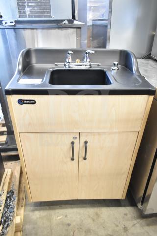 Brand new Ozark River ADSTM-AB-AB1N portable sink, scratch and dent, on commercial casters. Features wood cabinet, dual faucets.