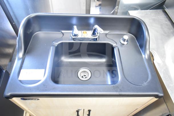 Brand new Ozark River ADSTM-AB-AB1N portable sink, scratch and dent, on commercial casters, black basin, chrome faucet.