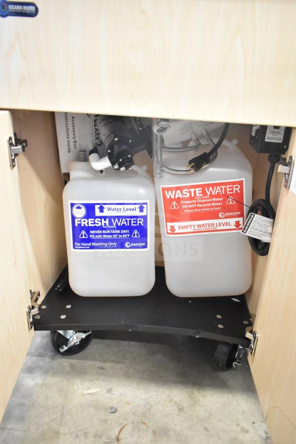 Brand new Ozark River ADSTM-AB-AB1N portable sink, visible fresh and waste water tanks, on commercial casters.