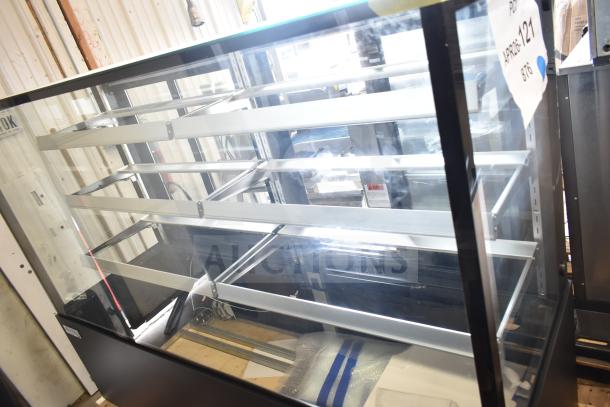 Brand new Avantco 193BCFD72B 70 7/8" black bakery display case with LED lighting. Scratch and dent condition.