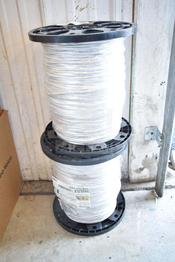 Two General Cable E3062S.41.86 spools, 12 gauge wire, stacked, with visible labels indicating specs and coiled wire.
