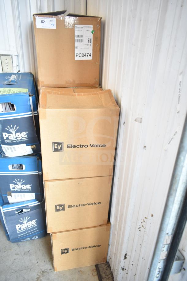 Stack of boxes containing Electro-Voice EVID-P6.2W speakers, labels indicate 7 units included.