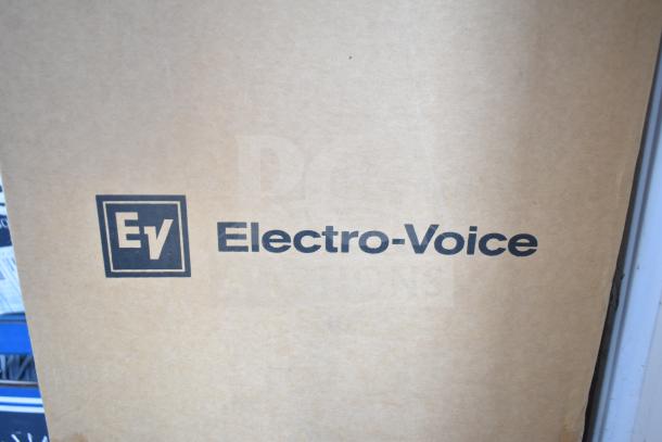 Cardboard box displaying Electro-Voice logo, containing 7 EVID-P6.2W speakers, suggesting brand-new condition.