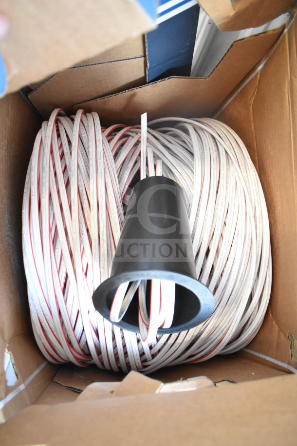 Three Paige Datacom Solutions 12/2C STR ZIP CL3 white cables, coiled in a box, suitable for datacom installations.